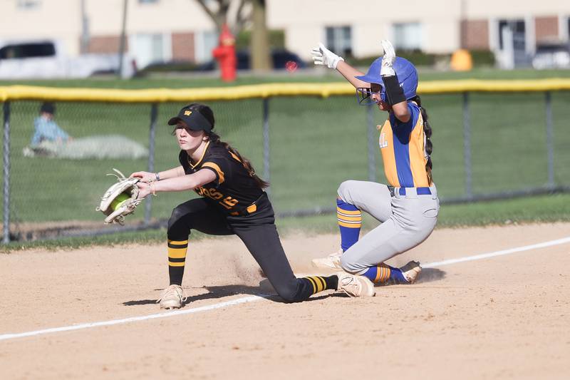Joliet Central’s Natalie Reyes beats the throw to Joliet West’s Hope Hughes on Tuesday, April 9, 2024.