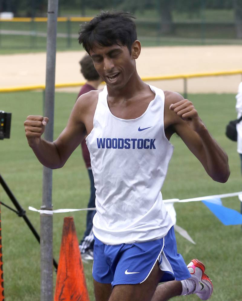 Woodstock Ishan Patel wins the boys race of the McHenry County Cross Country Meet Saturday, August 27, 2022, at Emricson Park in Woodstock.