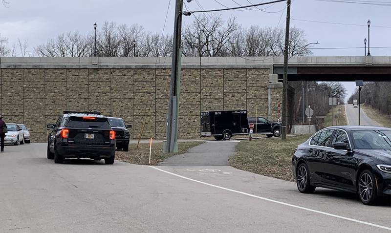 Vehicles with the Kane County sheriff and coroner's offices leave the area near the Fox River where a woman's body was found on Monday, Dec. 5, 2022.