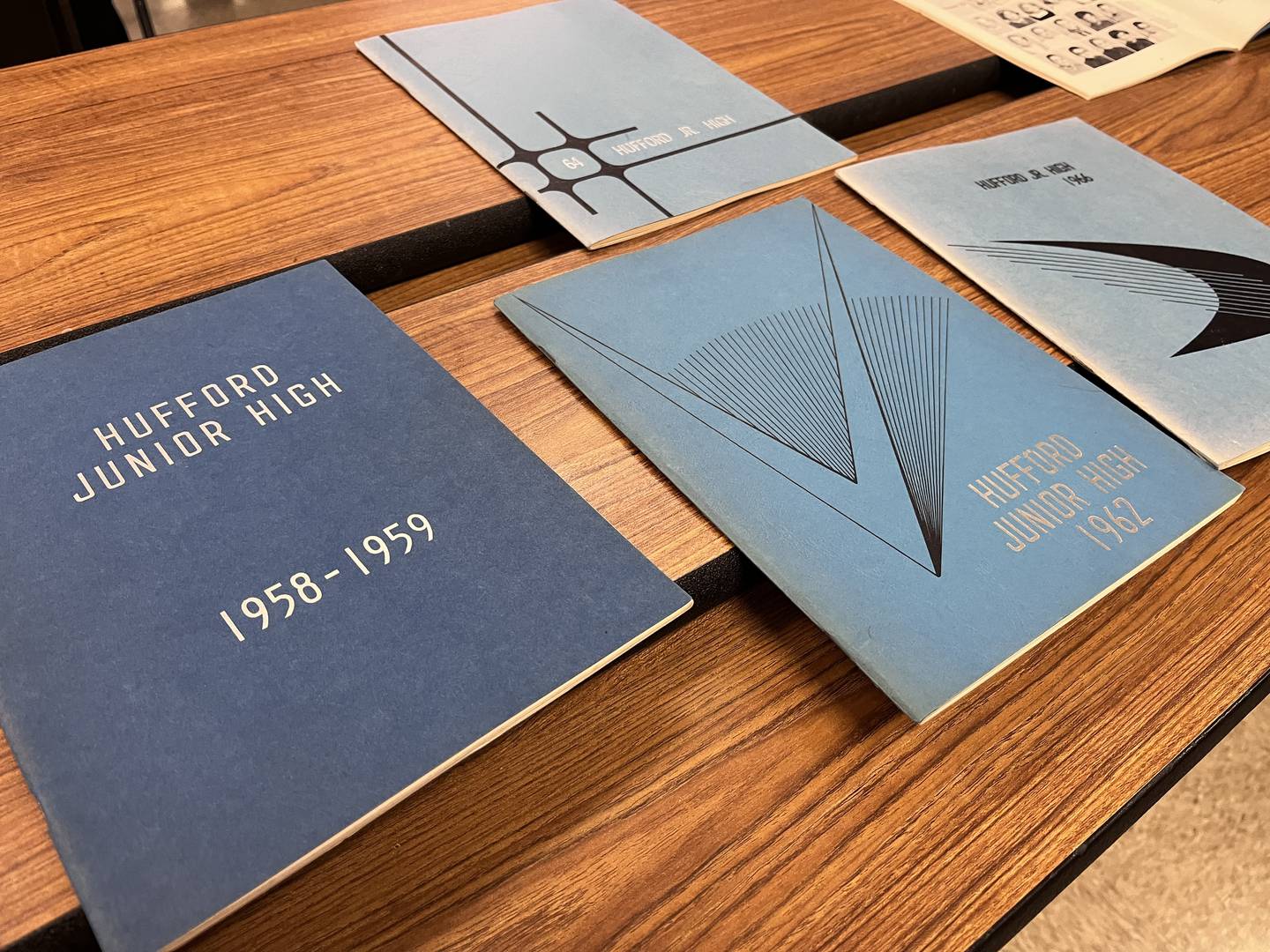 Old yearbooks for people attending an open house on Saturday, April 18, 2026, at Hufford Junior High School in Joliet. The building will close to make way for a new building in the fall.