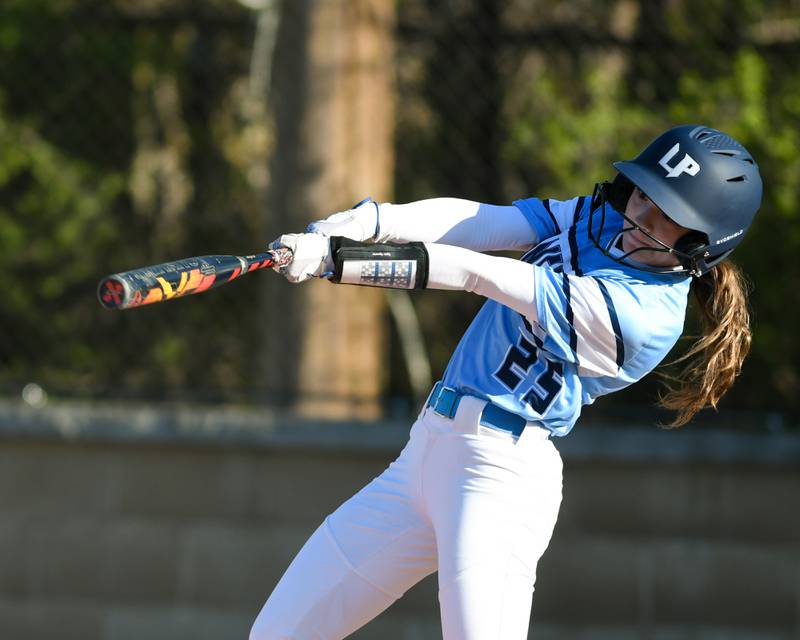 Lake Park's Gabriella Motisi (25) makes it to first base but was ruled out for leaving the batters box early during the game on Wednesday April 24, 2024, while taking on St. Charles North.