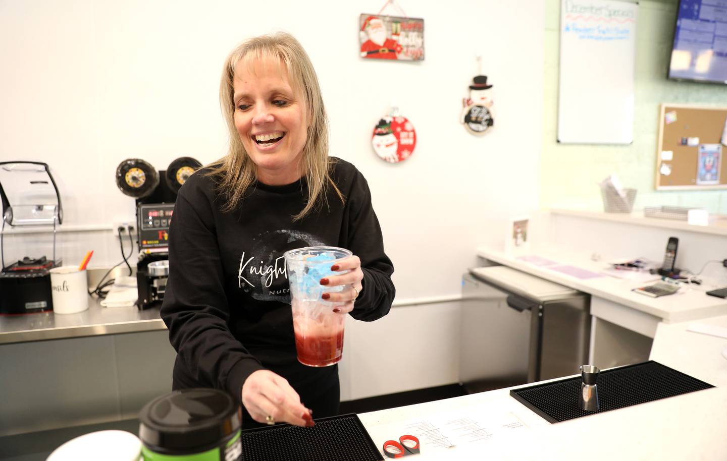 Lori Palmisano makes a Captain America Mega Tea. Palmisano and her daughter, Jessica Heinrich have opened Knight Club Nutrition on North Street in downtown Elburn.