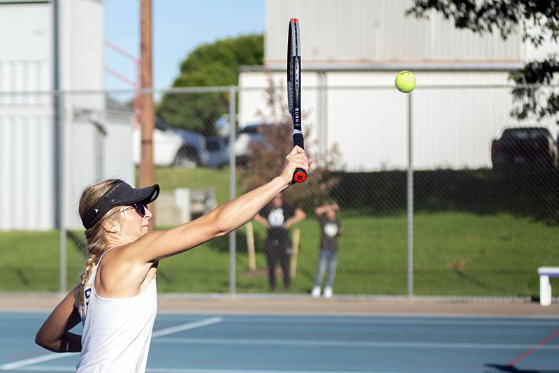 Sterling’s Eva Dillon returns the ball Thursday, Sept. 29, 2022 while playing doubles against Dixon.