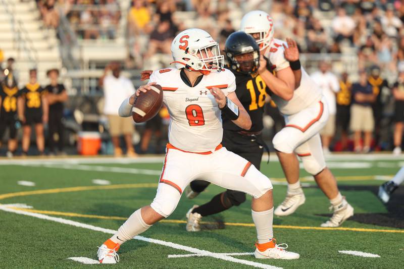 Shepard’s Jimmy Las Cola looks to pass against Joliet West on Friday, Aug. 25, 2023 in Joliet.