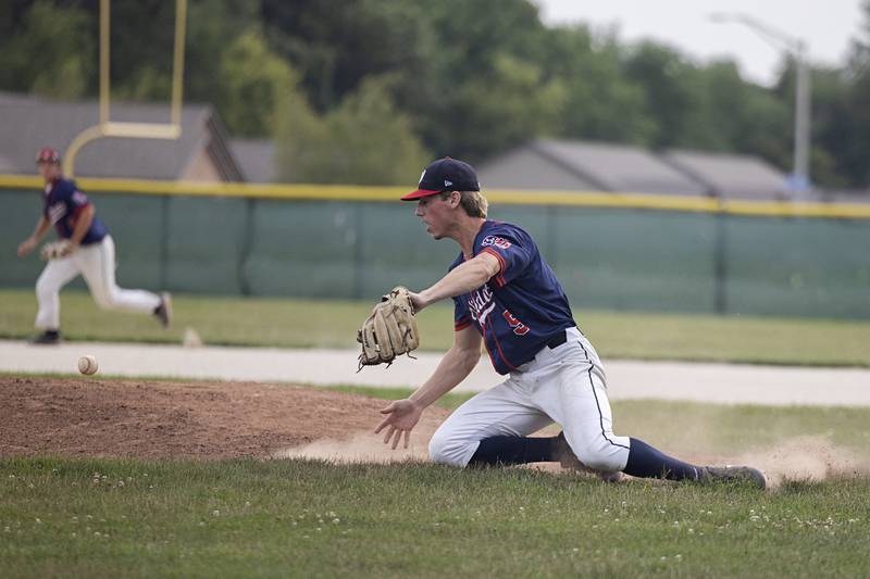 A ball skips by pitcher Bryce Rosenow of the Whiteside Wildcats semi-pro team against Palmer Wednesday, July 19, 2023.