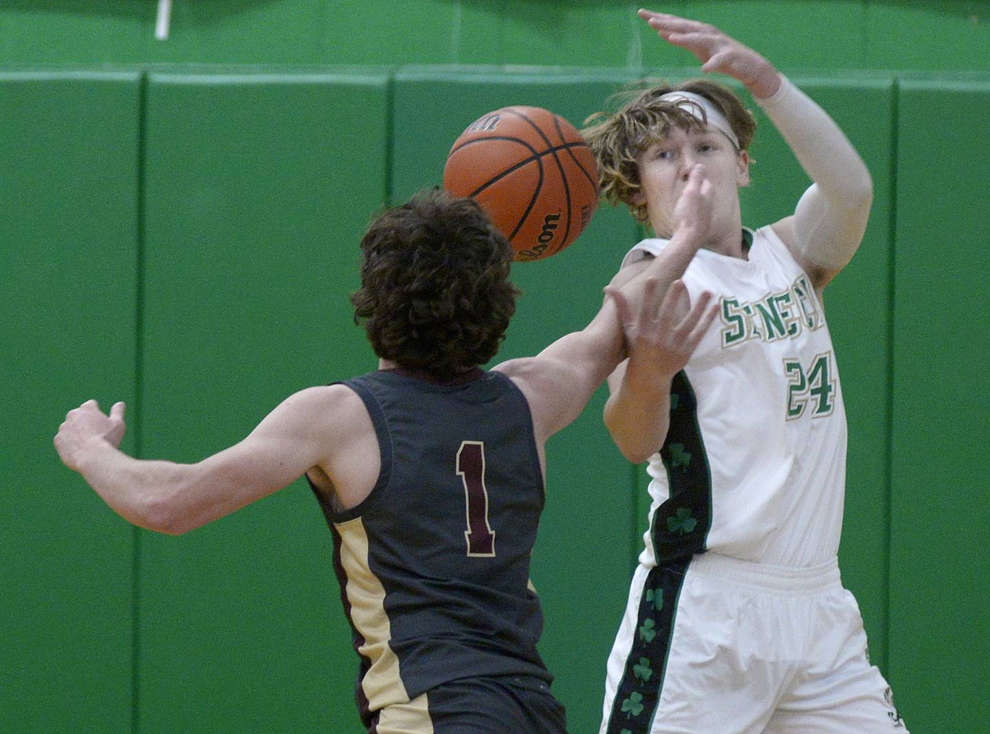 Morris’s AJ Zweeres and Seneca’s Grant Siegel battle for a rebound  in the 2nd period Tuesday at Seneca.