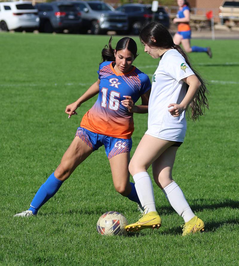 Genoa-Kingston's Alison Ayala works the ball past an opponent Thursday, April 23, 2026, during their game against North Boone at Genoa-Kingston High School.