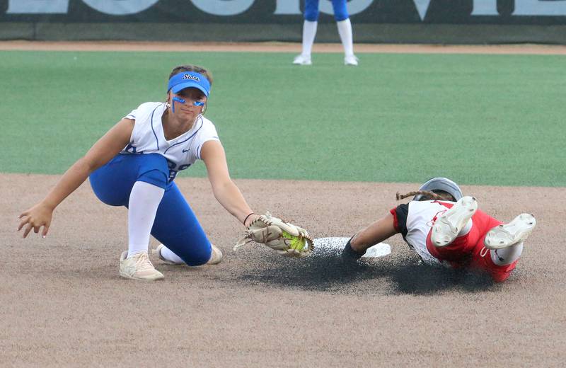 St. Charles North's Ginger Ritter misses a tag on a throw down attempt on Marist's Caroline O'Brien during the Class 4A championship game on Saturday, June 8, 2024 at the Louisville Slugger Sports Complex in Peoria.