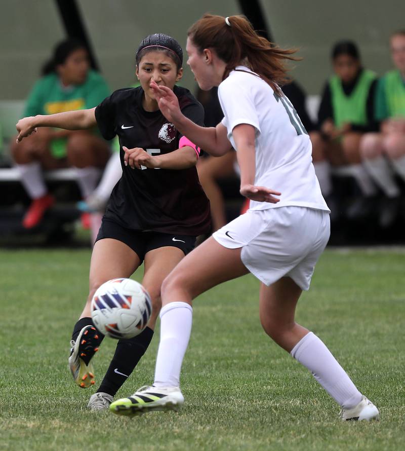 Prairie Ridge's Marissa Lemus kicks the ball towards the goal as she is defended by Crystal Lake South's Allison Ray during a Class 2A Crystal Lake Central Regional girls soccer semifinal match on Tuesday, May 19, 2026, at Crystal Lake Central High School.