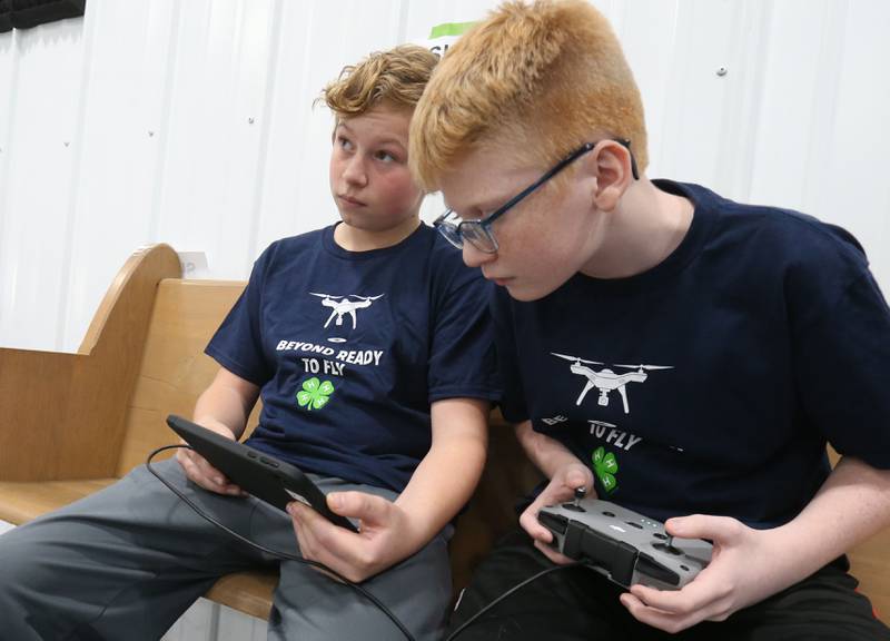 Noah Mollin of Princeton, and Pierce Hubbard of Princeton, fly their drone through obstacles during a drone competition on Saturday, Nov. 22, 2025 at the Second Story Teen Center in Princeton. Teams from Bureau, La Salle and Marshall-Putnam counties came together to showcase their flying skills during the event. Second Story Teen Center partnered with the University of Illinois Extension of Bureau, La Salle Marshall and Putnam Counties. Drones and awards were purchased through a grant and donations from Compeer Financial.