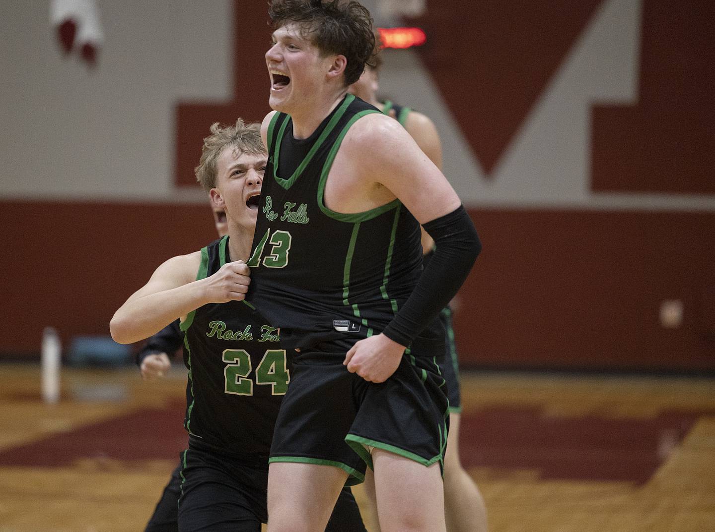 Rock Falls’ Ryken Howard (right) and Rock Falls’ Owen Mandrell celebrate Howard’s last second score to drive the Rockets to victory over Winnebago Tuesday, March 4, 2025, during the 2A boys basketball Sectional semifinal at Marengo.