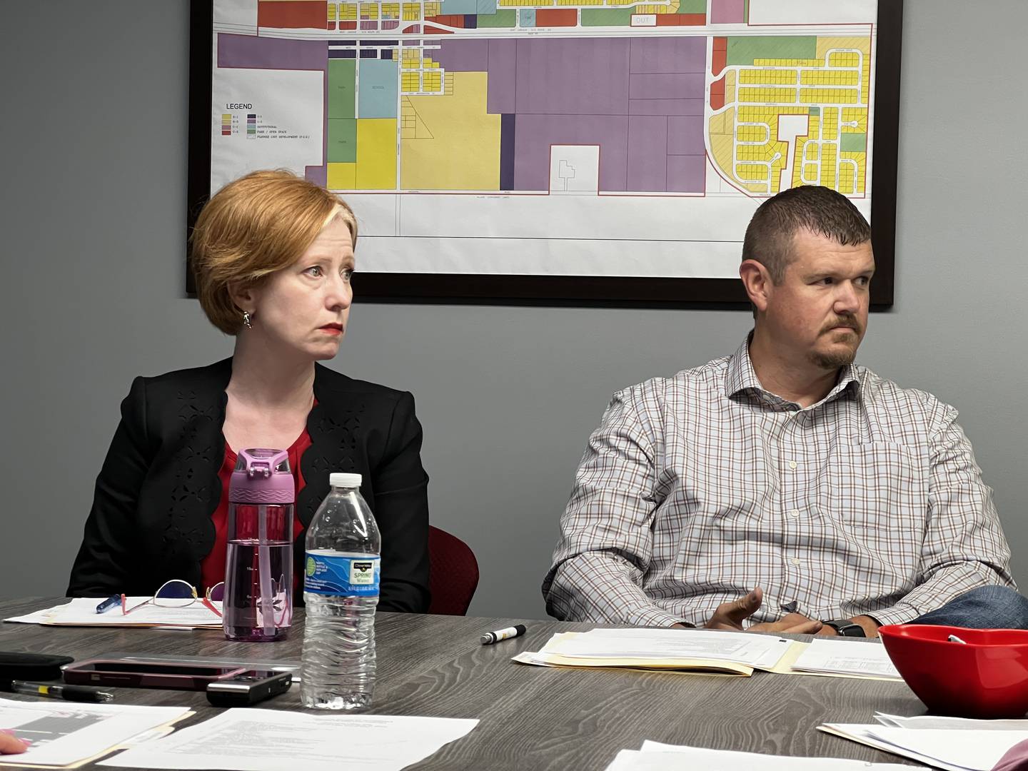 Heather Neveu, an attorney representing the village of waterman, sits next to Village Trustee Adam Pearson during a village board meeting on July 9, 2024.