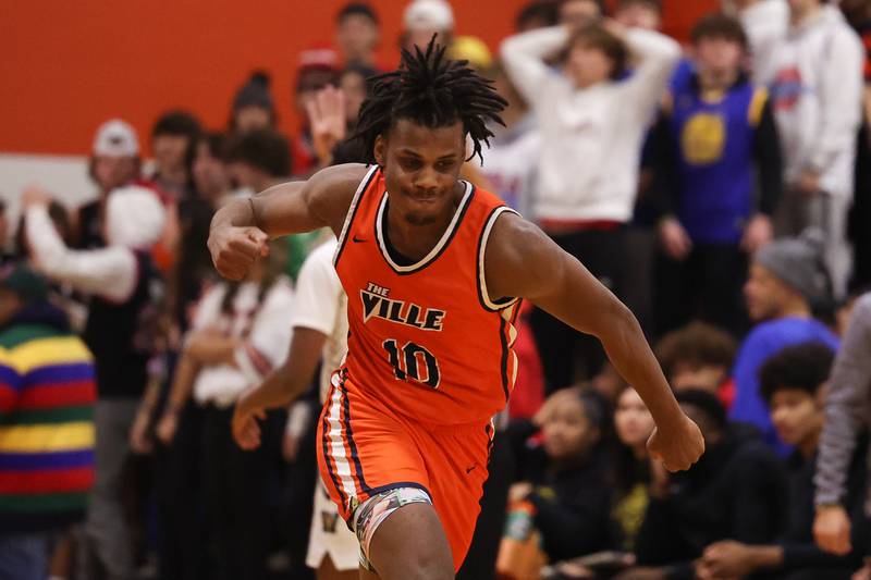 Romeoville’s Aaron Brown pumps his fist after a three point shot against Joliet West on Tuesday January 31st, 2023.