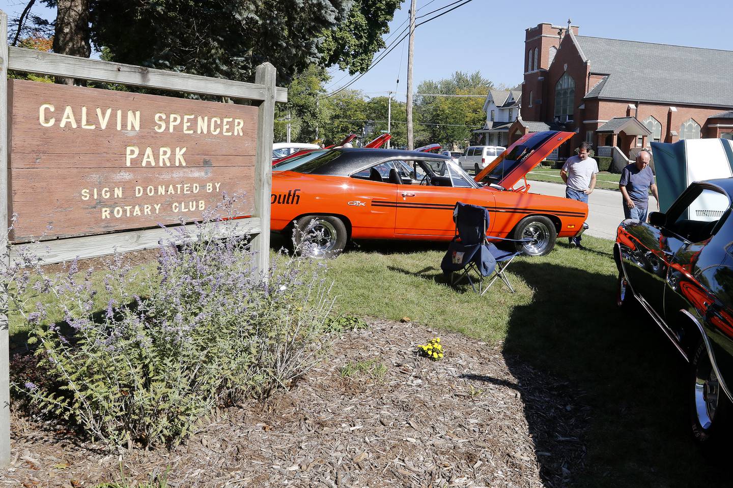 Rich Belmonte and son Mike Belmonte, both of Crystal Lake, check out the engines at the car show at Calvin Spencer Park during the annual Settlers Days events on Saturday, Oct. 9, 2021 in Marengo.