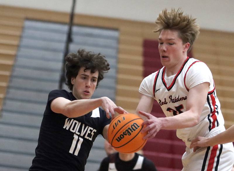 Huntley’s William Dillon, right, battles Prairie Ridge’s Ben Gablenz in varsity boys basketball on Tuesday, Feb. 18, 2025, at  Huntley High School in Huntley.