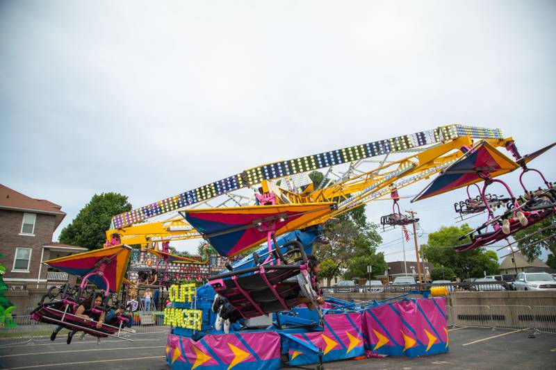 Swedish Days attendees ride the Cliff Hanger carnival ride at Swedish Days on Saturday, June 25, 2022.