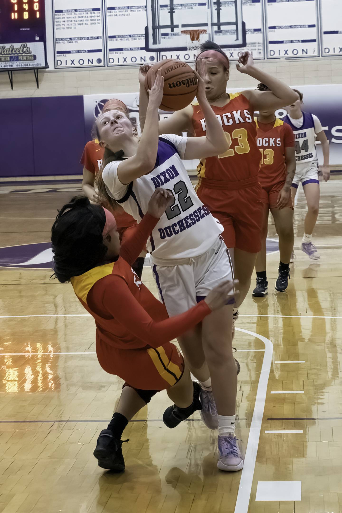 Dixon's Katie Drew drives the lane against Rock Island during their Class 3A Dixon Regional semifinal Tuesday, Feb. 14, 2023 at Lancaster Gym.