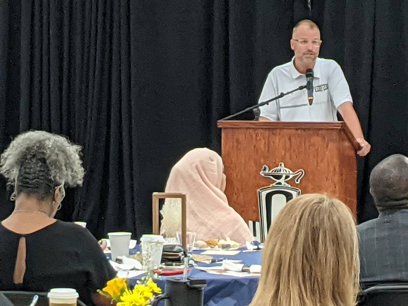 Bednarcik Junior High School principal John Francis addresses those attending the first Annual SD 308 District Dialogue: CommUNITY in Education event June 11 at Oswego High School.