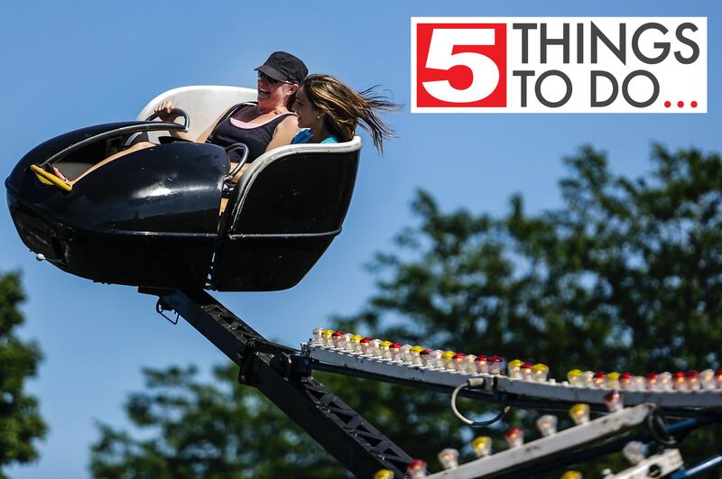 Amy Benitez of Spring Grove rides a carnival ride Saturday, July 13, 2013, with her daughter Sydney Benitez, 13, at the Fiesta Days celebration in McHenry.