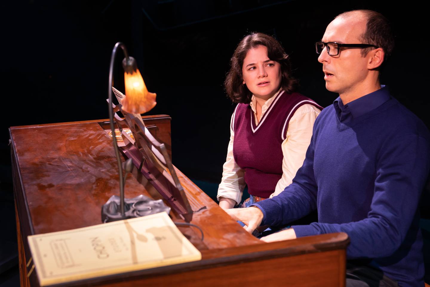Elizabeth Stenholt (left) plays Medium Alison and Stephen Schellhardt plays Alison’s father, Bruce, in Paramount’s BOLD Series production of Fun Home, running through September 18, 2022 at Paramount’s Copley Theatre, 8 E. Galena Blvd. in downtown Aurora. Tickets: paramountaurora.com or (630) 896-6666. Note: Liss rotates in the role of Small Alison with Maya Keane. Credit: Liz Lauren