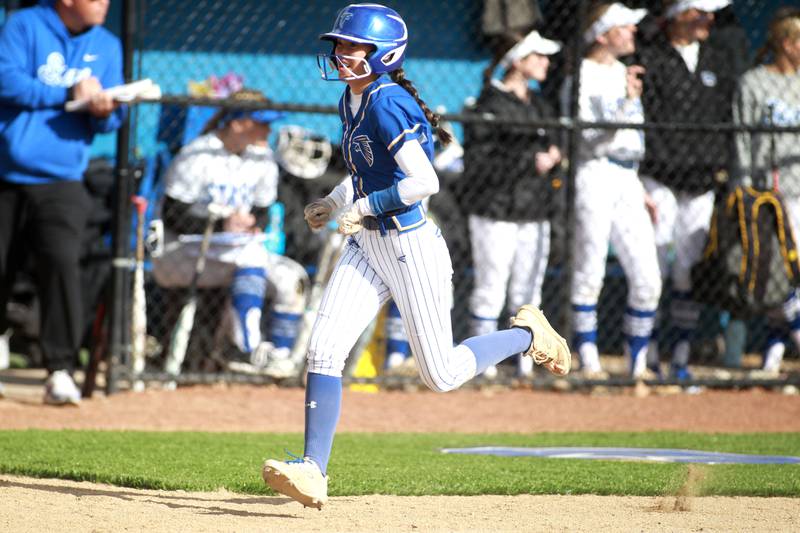 Wheaton North's Hana Stoner runs home for a score during a game against St. Charles North on Tuesday, April 15, 2025 in St. Charles.