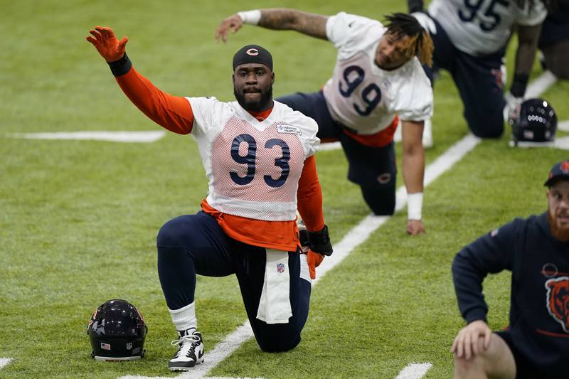 Chicago Bears defensive line Justin Jones warms up with teammates during the team's voluntary minicamp April 20, 2022 at Halas Hall in Lake Forest.