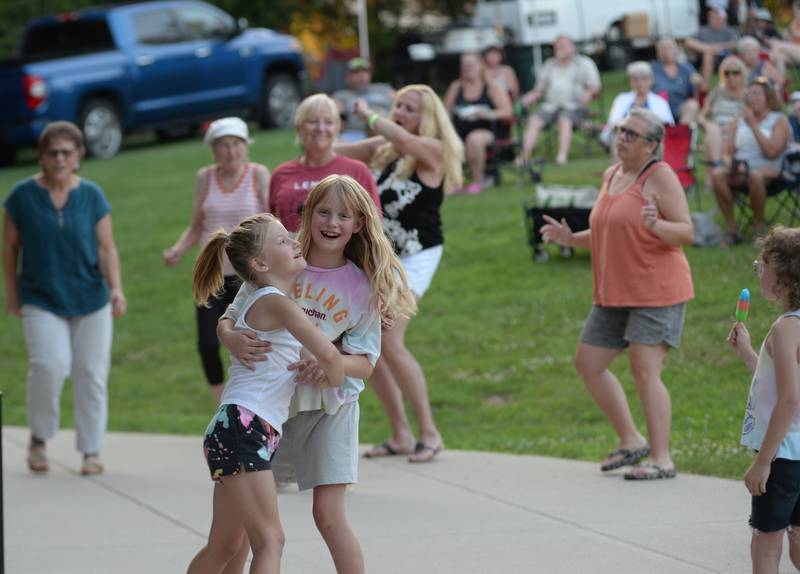 People dance to the music of Blue Steel at the Oregon Park District's Concert in the Park on Tuesday, July 15, 2025 at Oregon Park West. E.D. Etnyre Co. was the. sponsor for the outdoor concert.