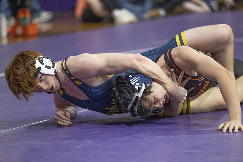 Sterling’s Cameron Minor (right) works on Freeport’s Steven Van Tuesday, Jan. 13, 2025, in a triangular meet at Dixon High School.