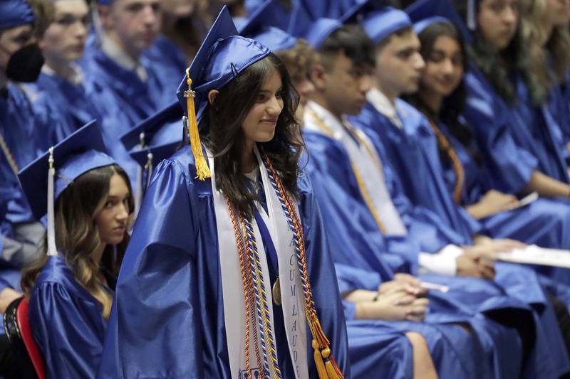 Valedictorian Mariam Jafri comes to the stage to present her speech during the  Burlington Central High School graduation ceremony Thursday May 19, 2022 DeKalb.