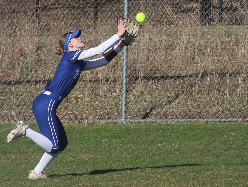 Princeton's Caroline Keutzer makes a running catch against Ottawa on Friday, March 13, 2026 at Ottawa High School.