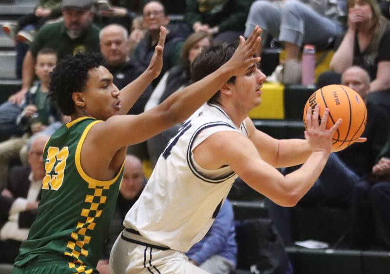 Crystal Lake South’s David McFadden, left, guards Cary-Grove’s Brady Elbert in boys IHSA Class 3A Regional Championship basketball on Friday, Feb. 27, 2026, at Crystal Lake South High School in Crystal Lake.