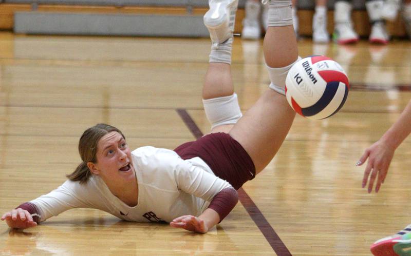 Prairie Ridge’s Grace Jansen dives for the ball against Hampshire during varsity volleyball on Thursday, Oct. 3, 2024, at Prairie Ridge High School in Crystal Lake.