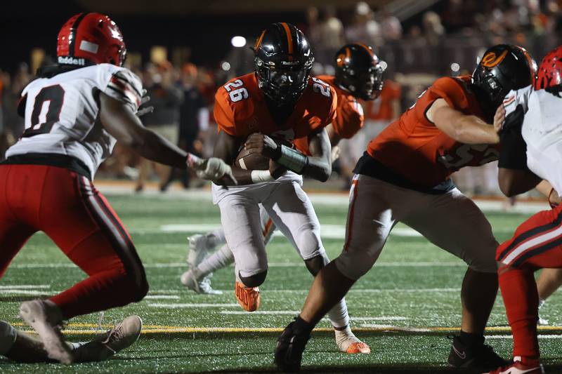 Lincoln-Way West’s Jahan Abubakar finds a hole on a run against Bolingbrook on Friday, Sept. 22 in New Lenox.