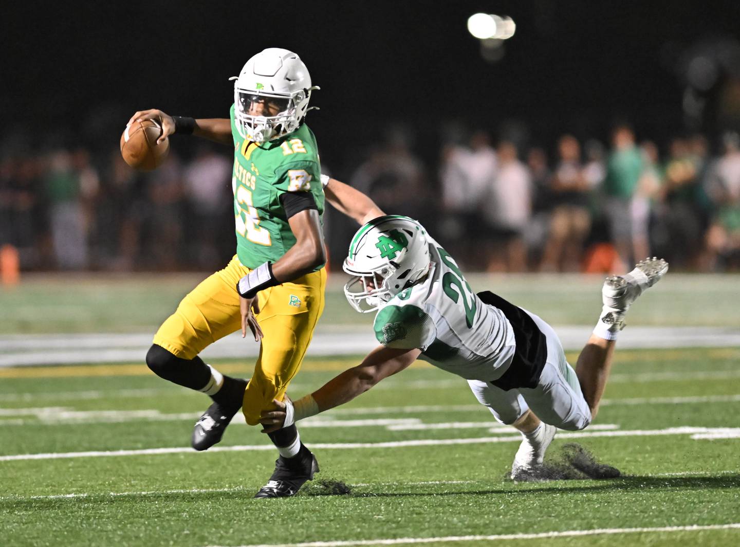 Providence Catholic's Aj Rayford rolls out the pocket during a conference game against Niles Notre Dame on Friday, Sep 20, 2024 at New Lenox. (Dean Reid for Shaw Local News)