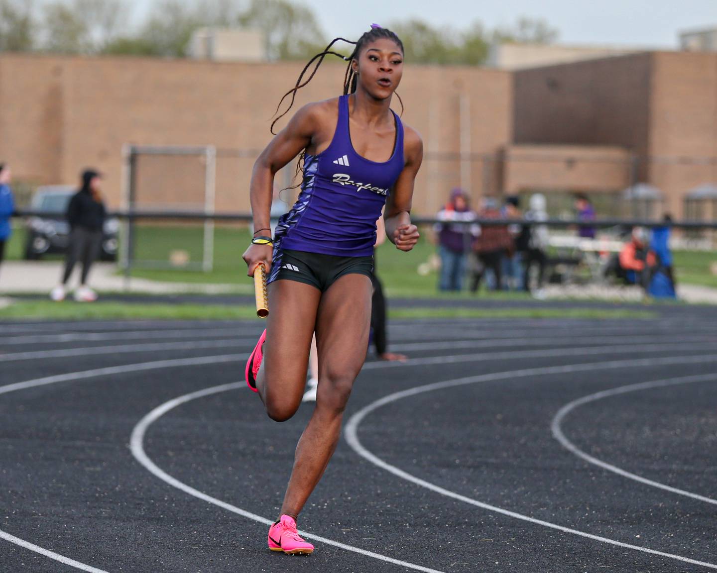 Plano's Favour Amakari runs in the 4x100 meters at the Field of Dreams Plano Invitational.  April 21, 2023.