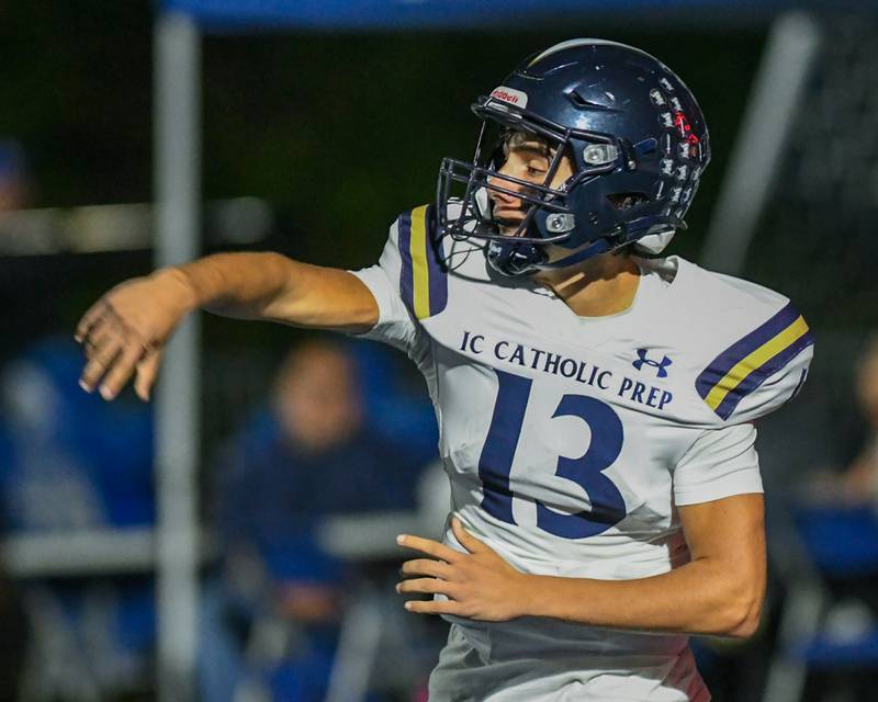 IC Catholic Prep's Nate Lang (13) tries a pass play during the game on Friday Oct. 3, 2025, while traveling to take on St. Francis High School.