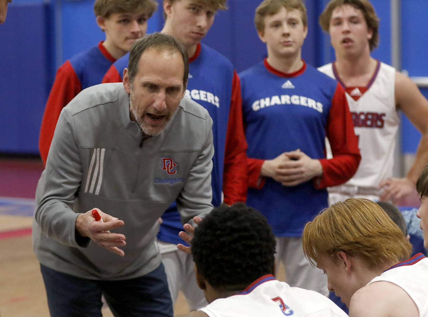 Dundee-Crown coach Lance Huber talks to his players between quarters during a Fox Valley Conference boys basketball game against Huntley Tuesday, Feb. 14, 2023, at Dundee-Crown High School in Carpentersville.