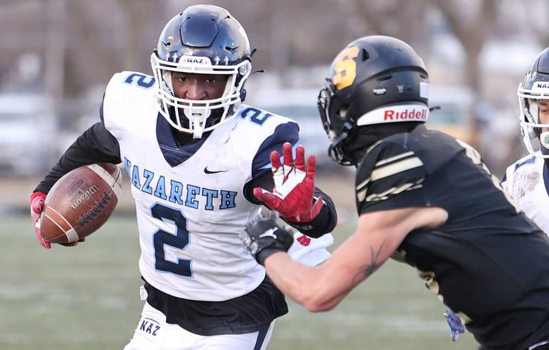 Nazareth's Justin Taylor looks to get by Sycamore's Elijah Meier Saturday, Nov. 18, 2022, during their state semifinal game at Sycamore High School.