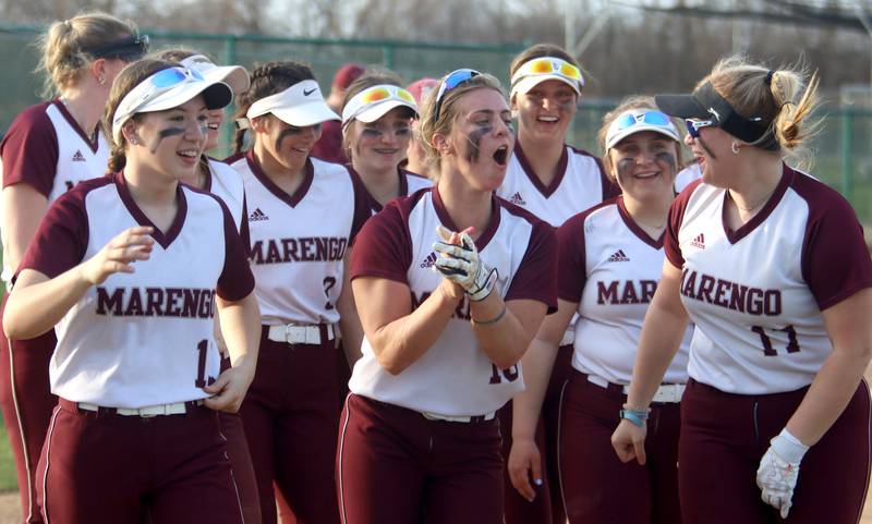 Marengo’s players get revved up after a win over Richmond-Burton in varsity softball at Marengo Tuesday.