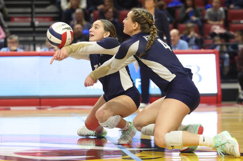 IC Catholic’s Natalie Lawton gets the dig in a near collision with Ava Falduto against Mater Dei in the Class 2A Volleyball Championship match on Saturday, Nov. 11, 2023 in Normal.