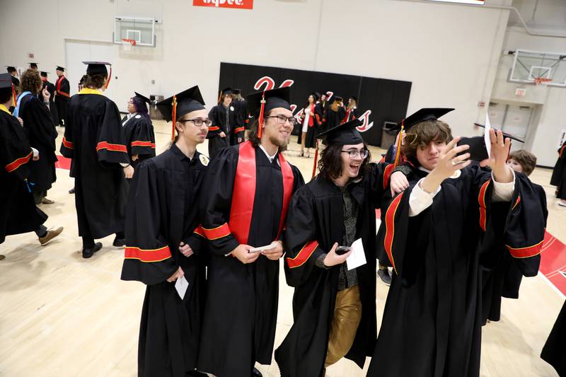 Batavia High School graduates (from left) Philip Boone, Jack Thompson, Brody Mehalic and Stephen Schwartz pose for a photo before the school’s 2025 commencement ceremony on Wednesday, May 21, 2025 at Northern Illinois University in DeKalb.