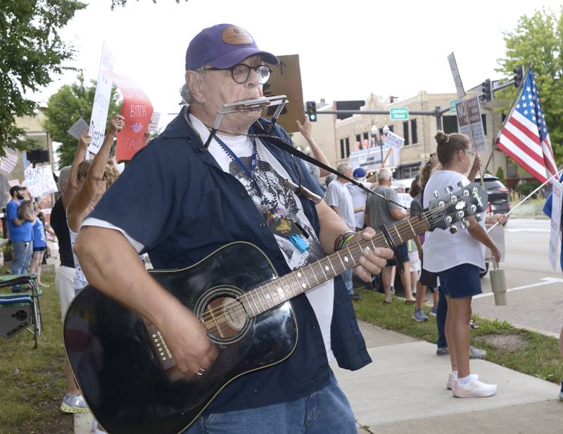 Protest music also accompanied the protest chants Saturday during the “Defend Our Democracy” rally at Washington Square in Ottawa.