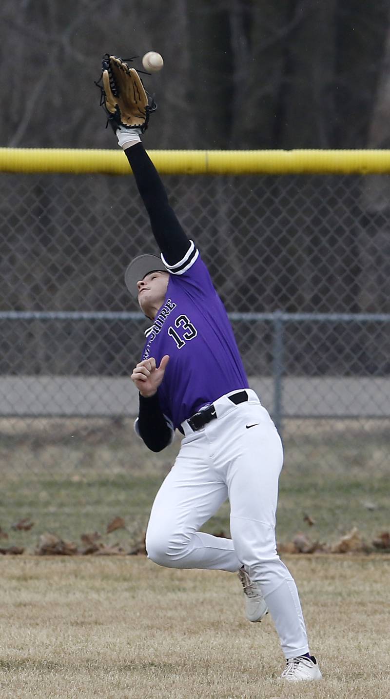 Hampshire's Nick Randell can’t make a catch the ball hit by Marengo's Carter Heimsoth during a non-conference baseball game Wednesday, March 30, 2022, between Marengo and Hampshire at Marengo High School.