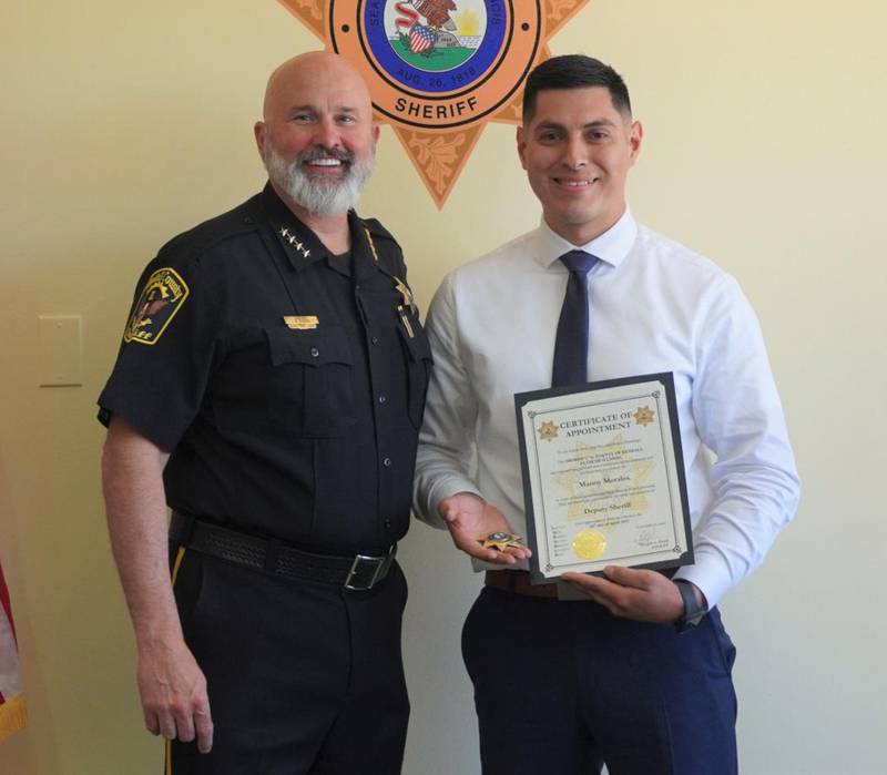 Kendall County Sheriff Dwight Baird (left) stands with new patrol deputy Emmanuel Morales.