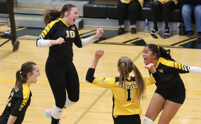 Putnam County volleyball players (from left) Ella Pyszka, Myah Richardson, Sarah Wiesbrock and Britney Trinidad react after defeating Orion in the first set during the Class 1A Regional final on Thursday, Oct. 30, 2025 at Putnam County High School.