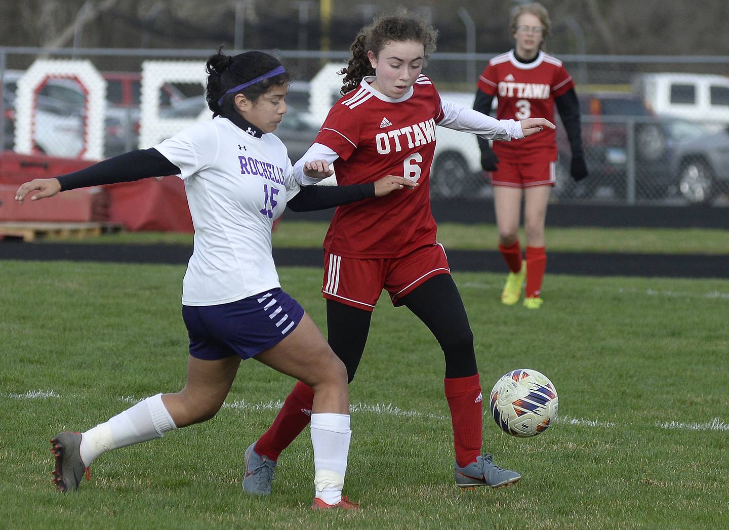 Ottawa’s Kindley Moore fights for control of the ball with Rochelle’s Betty Flores  in the first half during a match  on Wednesday, April 5, 2023 at King Field in Ottawa.