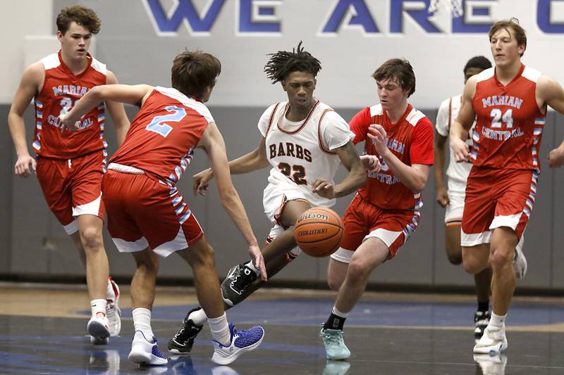 DeKalb's Darell Island cuts through the Marian Central defense during a Central High School’s Dr. Martin Luther King, Jr., Boys Basketball Tournament game Friday, Jan. 13, 2023, at Central High School in Burlington.