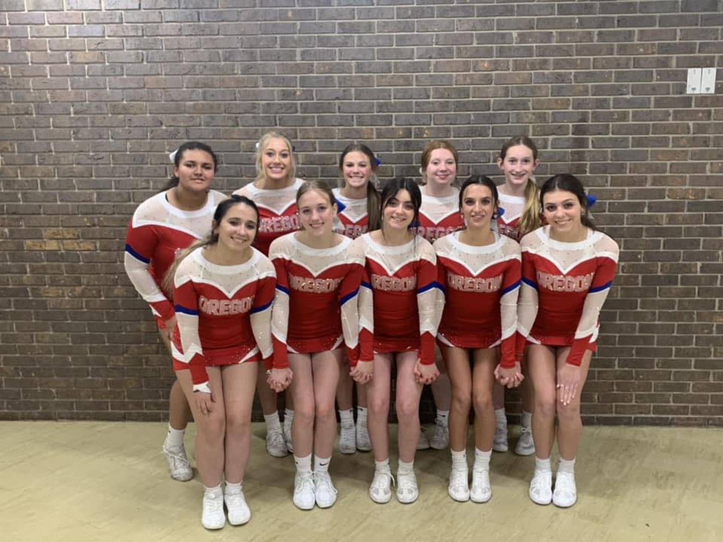 Oregon High School's competitive cheerleading team.  The competition roster includes Lariaha Hayes, Grace Eisenrich, Kaelin Shaffer, Keltie Champly, Taylor Weems, Alexis Ortega, Libby Patterson, Allysa Schefcik, Makena Barcai, and Aubree Schefcik.