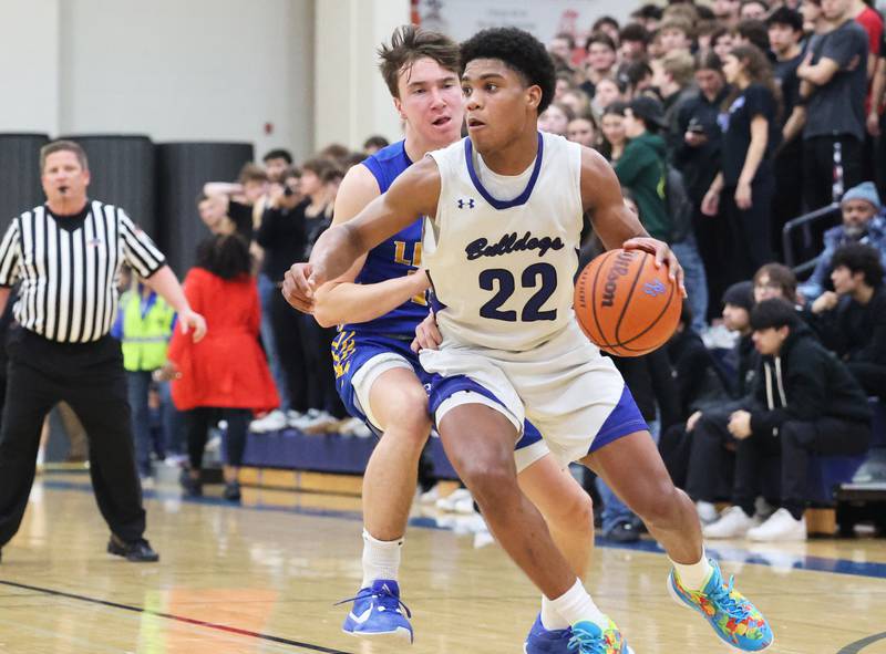 Riverside Brookfield’s Steven Brown (22) drives to the basket against Lyons during a boys varsity basketball game on Friday, Jan. 26, 2024 in Riverside, IL.