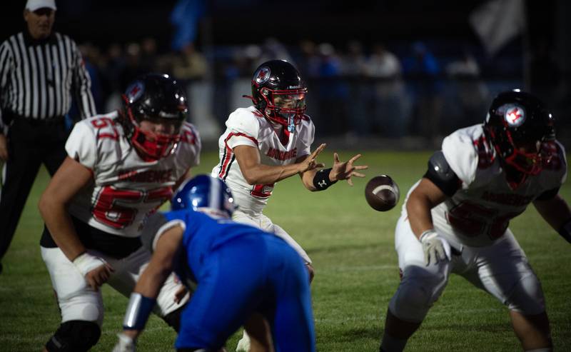 Momence's Erick Castillo takes a snap in a game against Clifton Central on Friday, September 5, 2025.